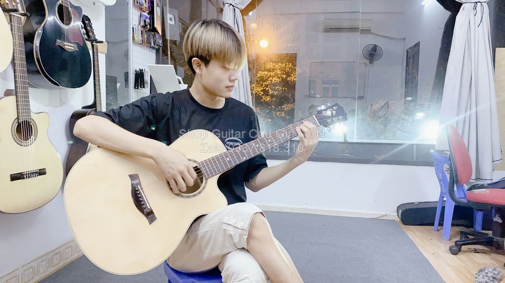 model 07 02 Dan Guitar Acoustic Tia Chop Viet J150 V wm
